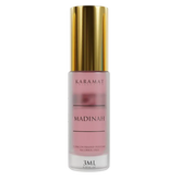 Roze parfumfles met gouden dop van Madinah Parfumolie - Karamat